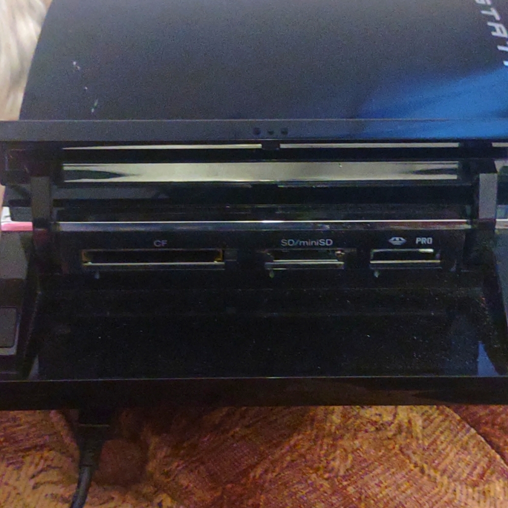 Original Playstation 3, 4 ports Infront trap door on top/front.